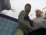 Teen Gives Handjob In Public Pool