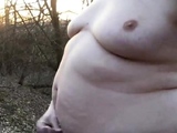 Chubby masturbates in the woods