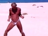 Tanned guy on beach in tiny string thong (temporarily!)