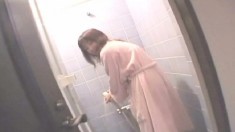 Japanese school girl cleans herself up after getting banged in a hotel
